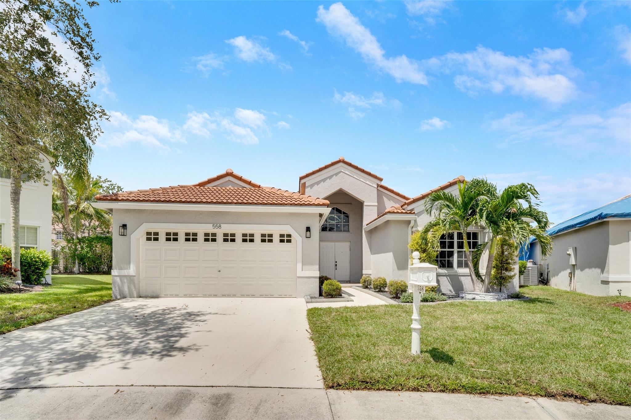 Nestled on a quiet cul-de-sac in the gated community of The Falls, this Weston home combines modern updates with a prime location. Sitting on the largest lot in the neighborhood (¼ acre), it features an open layout with 3 bedrooms, 2.5 baths, a 2-car garage, and a 30' x 10' pool. Renovations include a new 2022 roof and A/C, stylish new flooring, high ceilings with LED recessed lighting, a sleek kitchen with quartz countertops and black stainless appliances, a matching built-in bar, updated bathrooms, and custom closets. The PVC-fenced backyard offers privacy and plenty of space to relax or entertain. Zoned for A-rated schools and minutes from major highways, shopping, and dining, plus low HOA fees, this move-in ready home has it all