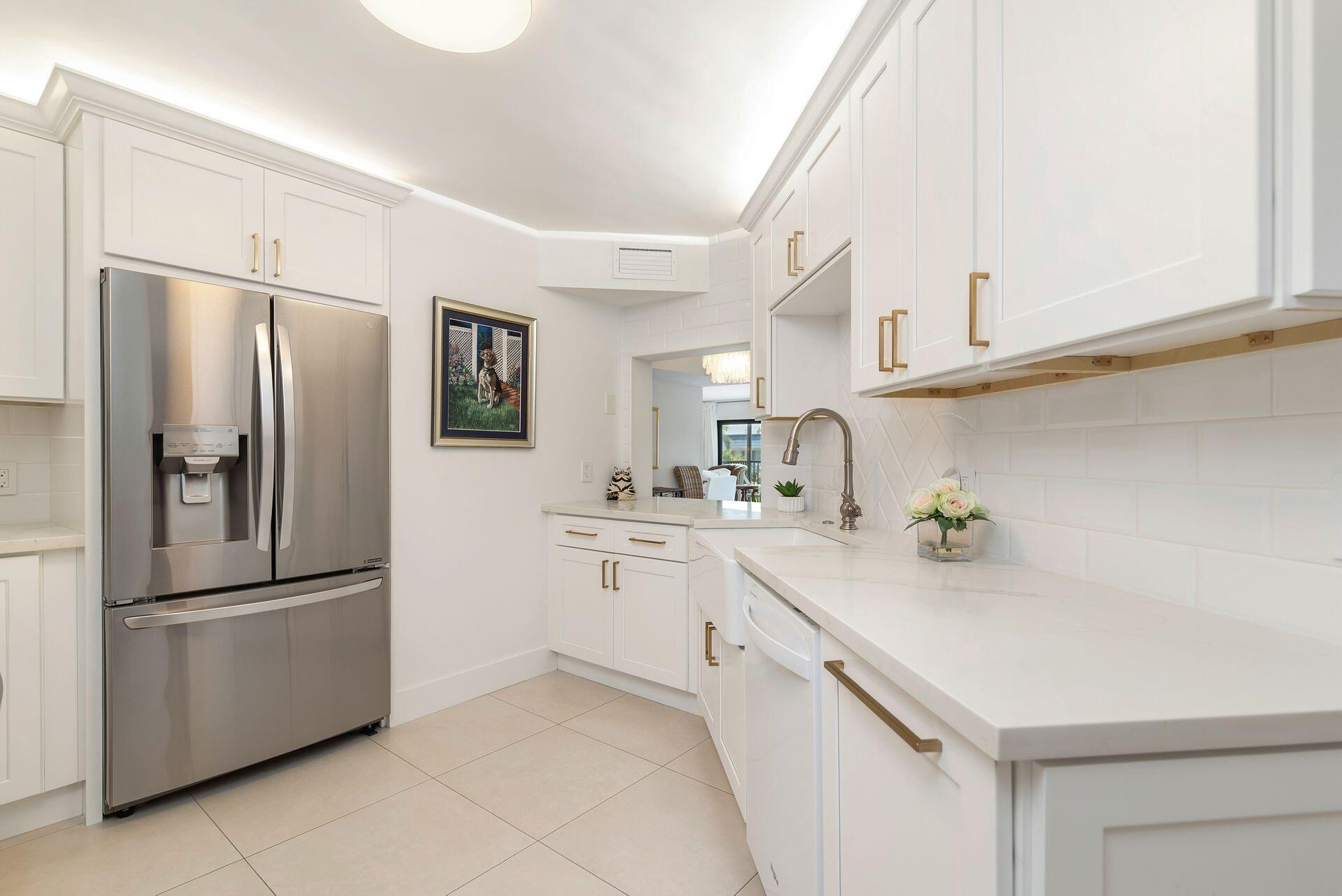 Beautifully updated and move-in-ready 3BR/2BA condo in the heart of North Palm Beach! This spacious 2,100 SF home features a split floor plan, impact windows/sliders, large tile floors, quartz countertops, stainless appliances, oversized washer/dryer, and a newer AC (2019) with 12-year warranty. The primary suite offers a walk-in closet and ensuite bath. Located minutes from top beaches, dining, shopping, marinas, PBI Airport, and Palm Beach Island. Roof 2023. Immaculate condition--priced to sell!