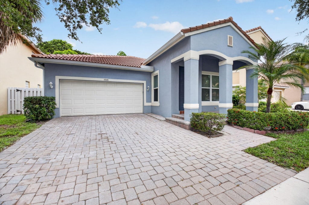 Photo of 5049 Sancerre Circle, Lake Worth, FL 33463 (MLS # B26039318)