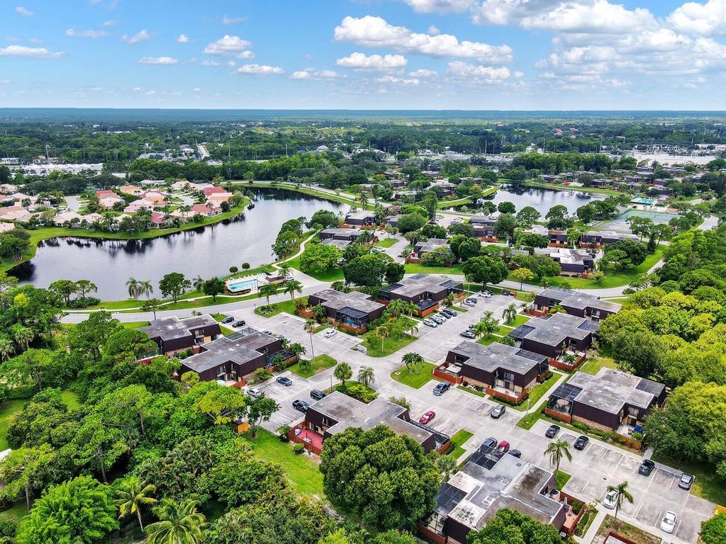 Photo of 5907 SE Windsong Lan E Lane, Stuart, FL 34997 (MLS # R10896995)