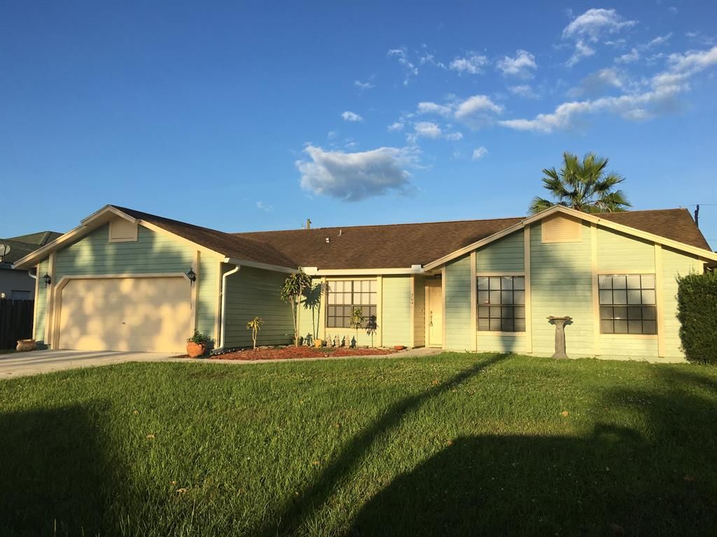 Photo of 2641 SW Eastman Street, Port Saint Lucie, FL 34953 (MLS # R10761344)