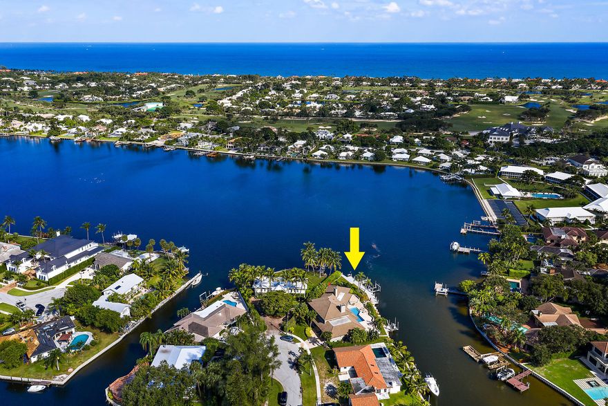 Rare opportunity offering 200' of deepwater frontage on one of North Palm Beach's most scenic lots!  This beautifully sited Waterfront  home is in coveted Hidden Key, a gated enclave East of US 1.  Design elements include true hardwood floors, custom wood plantation shutters, doors + pocket doors.  Roof was replaced in 2011. Enjoy serene + secure living on Little Lake Worth (w/ easy Ocean access). You can fish off your private dock!  Water views from all main living areas.  All bedrooms offer ensuite baths.  Residents of North Palm Beach enjoy a newly renovated public country club w/ signature Jack Nicklaus golf,  Olympic sized pool, fabulous tennis + Gorgeous indoor/outdoor dining overlooking the golf course. This home is close to best beaches, shopping, dining, educational & cultural venues.  20 min to PB Int'l airport.  A fabulous place to live!