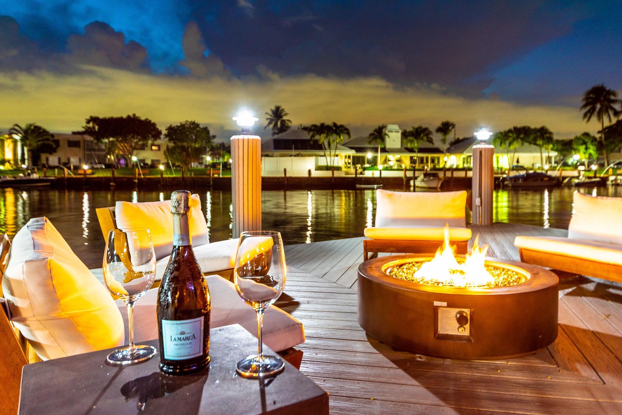 CUSTOM-BUILT WATERFRONT MASTERPIECE – Recently renovated 5-bedroom, 3.5-bath home with 2-car garage on a private cul-de-sac. This one-of-a-kind residence offers approx. 3,200 sq. ft. under air and 140 feet of waterfront with a 120-ft dock w/water & electric, providing space for a large boat and jet skis. Enjoy wide-water views, impact windows & doors, and an entertainer’s backyard with a heated pool, hot tub, summer kitchen, wet bar, tiki hut, gazebo, fire pit & covered patio..Perfect for gatherings or relaxed coastal living. Inside features an open layout, modern finishes, oversized beverage fridge, primary suite with a w/built-in bar. A true entertainment paradise where luxury meets waterfront lifestyle.- Property is available for Seasonal Rental as well as Annual