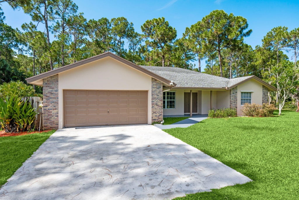 Photo of 16628 Valencia Boulevard, The Acreage, FL 33470 (MLS # B26050117)