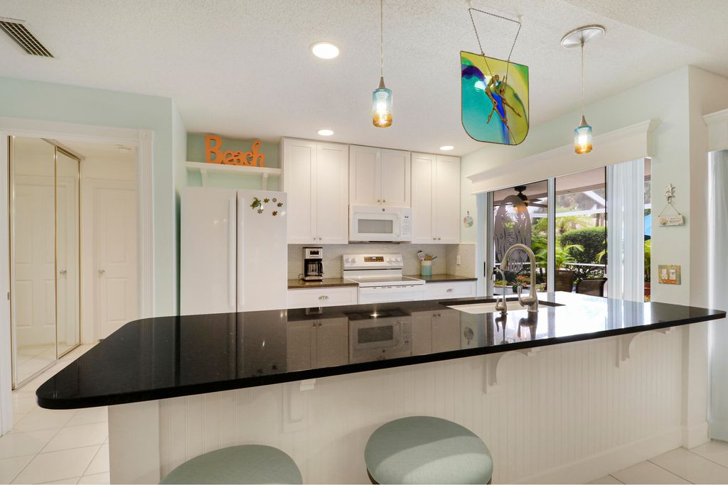 Photo of 10301 Chapman Oak Court, Palm Beach Gardens, FL 33410 (MLS # B26045370)