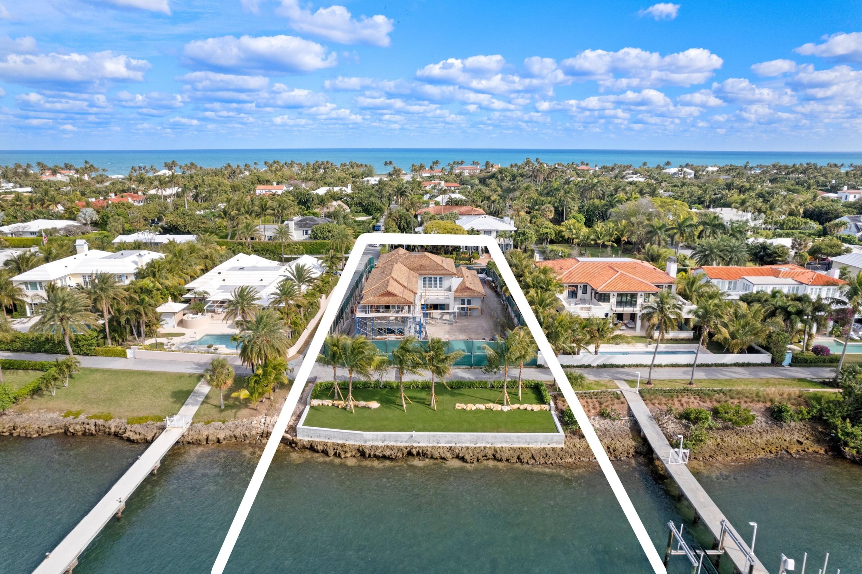 Brand-new construction on North Lake Way built by Wildes Builders and LaBerge and Menard Architect's. Featuring 90 feet of waterfront, a new dock, and luxurious interiors. Upon entering, you are greeted by a grand foyer with Jerusalem Gold limestone flooring that leads into the spacious living areas. The main floor boasts an open kitchen equipped with Gaggenau and Sub-Zero appliances, Taj Mahal stone countertops, an island with seating, and a breakfast area. This space seamlessly flows into the family room, which opens to a covered outdoor loggia overlooking the large pool. Adjacent to the kitchen is a butler's pantry, also outfitted with Taj Mahal stone countertops, and a private dining room for formal gatherings. The separate living room provides additional space for relaxation or