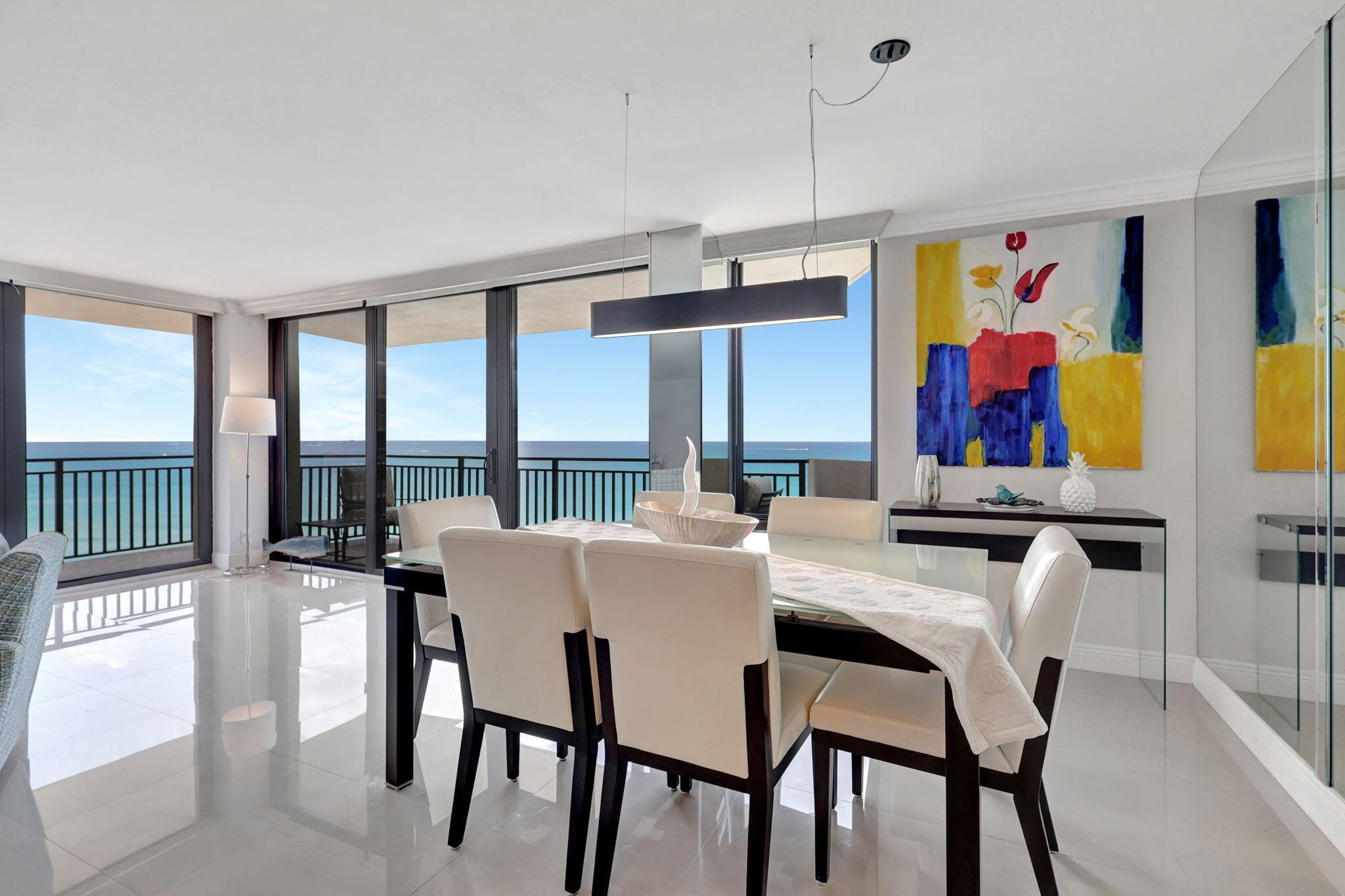 Direct ocean Singer Island condo with stunning ocean and intracoastal views. Large wrap around balcony accompanied by private balconies for each bedroom. Private washer/dryer in the unit. Brand new blinds on remote in both bedrooms and the main living area. All tile floors (no carpet), updated kitchen with SS appliances, and beautifully renovated bathrooms. All impact windows. Seawall work will be happening Nov 1 to Jan 31. Building was recently renovated in the lobby, elevators, and hallways. The building just finished concrete restoration and exterior improvements. Enjoy peace and quite, a walk on the beach, a swim in the pool, tennis, and the many nearby restaurants and shops on Singer Island and nearby Palm Beach Gardens and Jupiter. Plenty of storage with 2 storage cages.