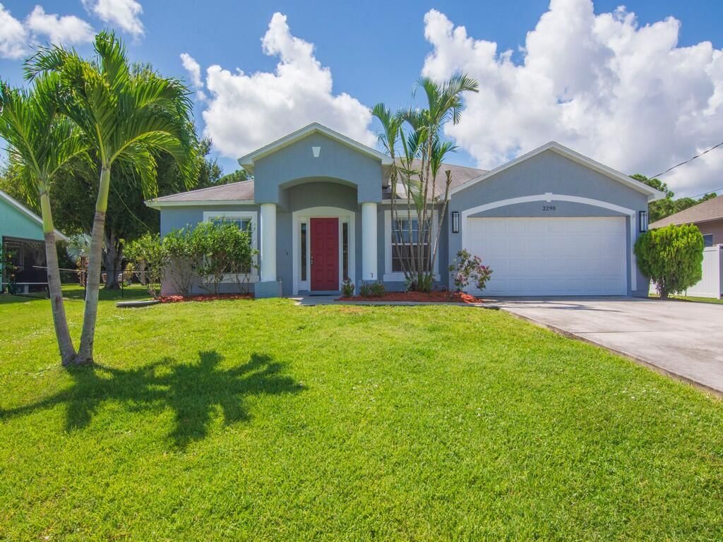 Photo of 2290 SE Grand Drive, Port St Lucie, FL 34952 (MLS # R10916454)