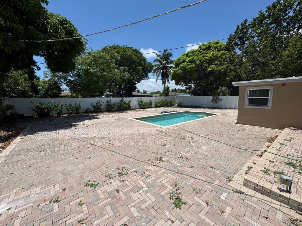 Photo of 330 Cypress Drive #A, Lake Park, FL 33403 (MLS # R11118173)