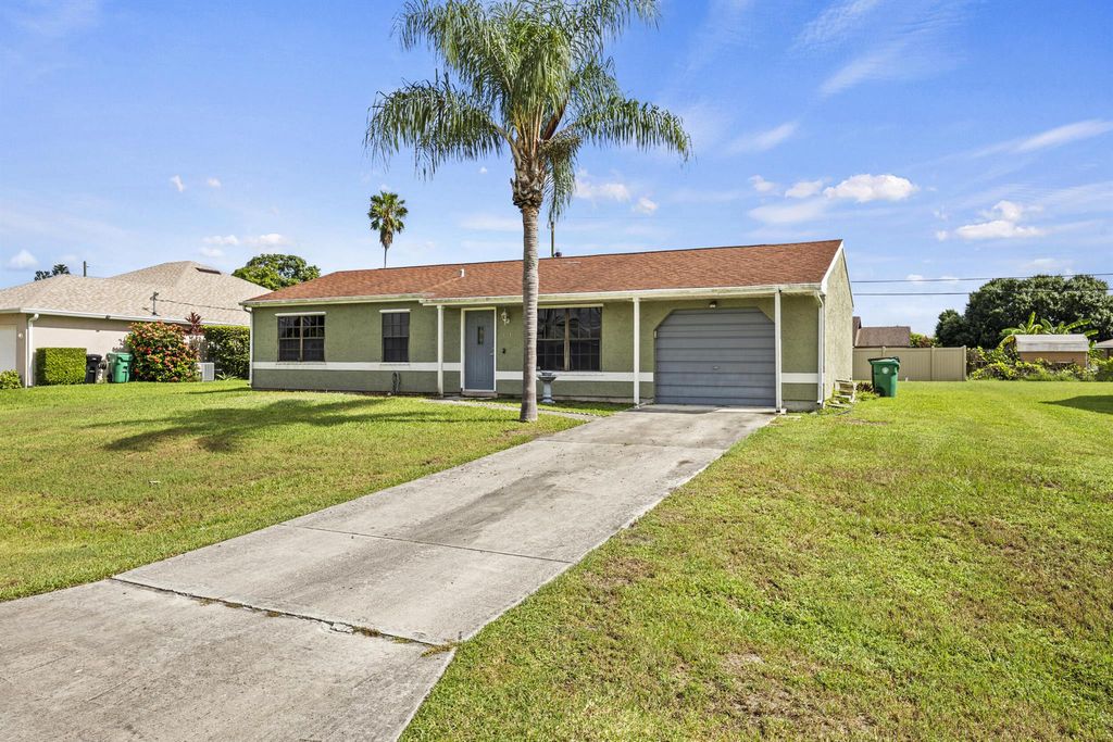 Photo of 621 SW Stillman Avenue, Port Saint Lucie, FL 34953 (MLS # R11114982)