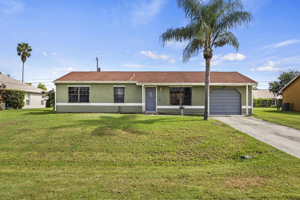 Photo of 621 SW Stillman Avenue, Port Saint Lucie, FL 34953 (MLS # R11114982)