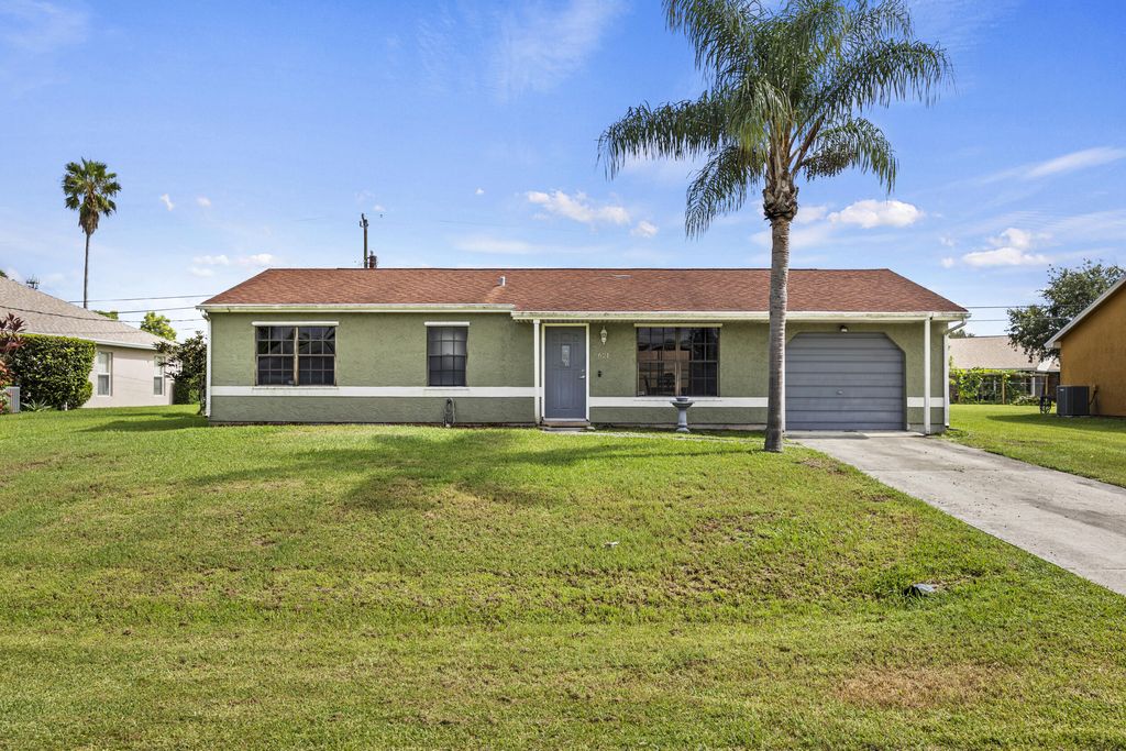 Photo of 621 SW Stillman Avenue, Port Saint Lucie, FL 34953 (MLS # R11114982)