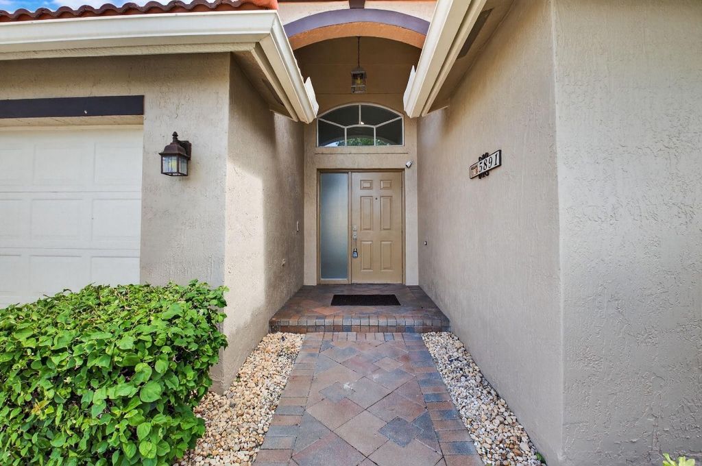 Photo of 5891 Royal Isles Boulevard, Boynton Beach, FL 33437 (MLS # F10518745)