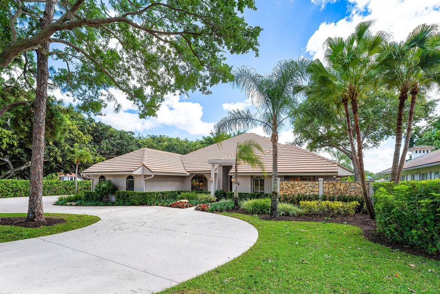 Set on an exceptionally private half-acre corner lot at the end of a quiet cul-de-sac, this Marlwood at PGA National home offers sweeping water and golf course views. A thoughtfully designed floor plan features light-filled living spaces, including a living room with a stone fireplace and two sets of French doors opening to the covered patio and pool — ideal for seamless indoor-outdoor living. The updated kitchen is appointed with granite countertops, maple cabinetry, stainless steel appliances, and dual ovens. A flexible 4th bedroom serves as a spacious office or den, perfect for work or additional guest space. Outdoors, enjoy a serene, landscaped setting with a private pool and expansive patio area. Located within the renowned PGA National community, residents enjoy access to a world- -class lifestyle centered around championship golf, including the famed Champion Course — home of the PGA Tour's Cognizant Classic. PGA National Resort also offers a full-service spa, tennis facilities, fine dining, and a recently reimagined luxury resort experience, all just minutes from shopping, dining, and pristine Palm Beach County beaches.