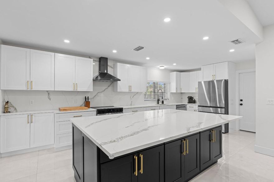 This stunning 2-bedroom, 2.5-bath residence sits on an oversized lot in one of the most centrally located and desirable areas, offering the perfect blend of luxury, comfort, and convenience. Completely renovated from top to bottom, this dream home features a brand new roof, new AC system, new water heater, full impact windows, new washer and dryer, and new flooring throughout the home, ensuring modern efficiency and long lasting peace of mind.
Step inside to an open, sun filled layout showcasing high-end finishes and thoughtful design. The beautifully redesigned chef's kitchen is the true centerpiece, featuring elegant quartz countertops, stainless steel appliances, an oversized island perfect for entertaining, and an extra-large walk-in pantry that brings both function and style. Whether hosting gatherings or preparing everyday meals, this kitchen elevates the experience.
The expansive primary suite offers a serene retreat with a custom-finished closet and a fully renovated spa-inspired bathroom, complete with premium tilework, modern fixtures, and private access to the patio ideal for morning coffee or evening relaxation. The second bedroom also enjoys its own beautifully renovated bathroom, providing comfort and privacy for guests or flexible use.
A spacious 2 car garage with a professionally finished epoxy floor adds a polished touch and exceptional durability. Outside, the oversized lot provides ample room to enjoy the outdoors, garden, or create your own personalized oasis.
Located within a secure, gated community, residents enjoy access to a clubhouse, sparkling pool, tennis courts, and pickleball offering a resort-style lifestyle right at home. The neighborhood is just minutes from a wide variety of stores, restaurants, and shopping destinations, making everyday living effortless and enjoyable.
Move in ready and meticulously upgraded, this home delivers modern luxury, thoughtful craftsmanship, and unbeatable convenience in one exceptional package.