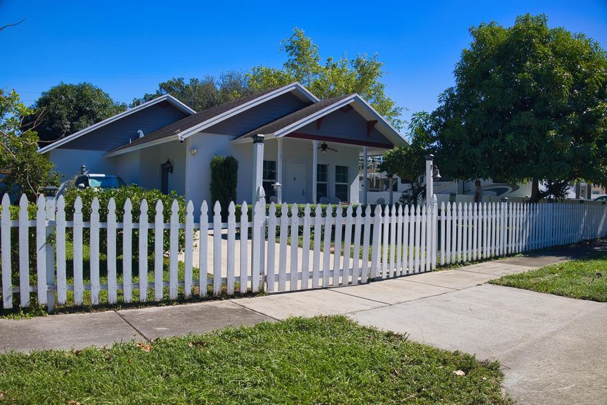 Charming and functional, this ranch-style 3-bedroom, 2-bath home at 2308 Fairway Dr offers stylish living in a peaceful West Palm Beach setting. Inside, enjoy tile flooring in the main living areas and low-maintenance laminate flooring in the bedrooms. The open layout flows into a granite kitchen with custom cabinetry and a mix of modern appliances. The spacious primary suite includes a walk-in closet and dual-sink vanity, while secondary bedrooms offer versatility. Out back, unwind on the covered patio overlooking a private, landscaped yard. With a wide pavered driveway, no HOA, and a location close to I-95, shopping, and dining -- this one is move-in ready!