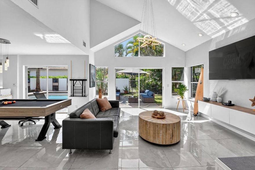 Discover this beautifully updated 2-story townhouse located in the sought-after village of Cedar Cay in the prestigious Broken Sound Country Club. This 3-bedroom, 2.5-bath home combines modern design with comfortable living.  Step inside to find smooth walls, porcelain tile floors on the main level, and soaring vaulted ceilings that create a bright, open atmosphere. The sleek kitchen is designed for both style and function, featuring quartz countertops with a waterfall edge, stainless steel appliances, and ample cabinet space.  Upstairs, the spacious primary suite offers a walk-in closet and a luxurious en suite bath with a freestanding soaking tub and frameless glass shower. Two additional bedrooms and a full bath complete the second floor, providing plenty of room for family or guests. Enjoy the best of indoor-outdoor living with a private backyard pool and the rare benefit of direct backyard access to the Cedar Cay heated community pool.  With a prime location in one of Boca Raton's most desirable country club communities, this home offers the perfect blend of luxury, convenience, and resort-style living.

-GARAGE HAS BEEN CONVERTED INTO A BEDROOM
-COUNTRY CLUB MEMBERSHIP MANDATORY