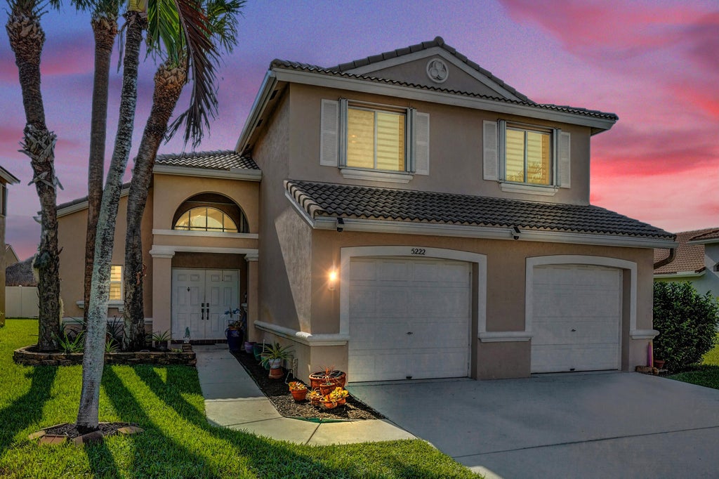 Photo of 5222 Prairie Dunes Village Circle, Lake Worth, FL 33463 (MLS # B26047122)