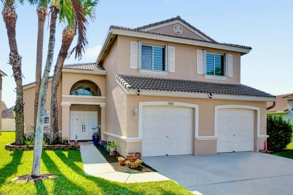 Photo of 5222 Prairie Dunes Village Circle, Lake Worth, FL 33463 (MLS # B26047122)