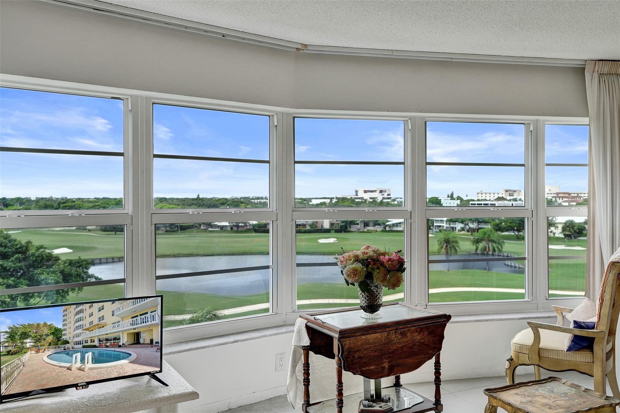 Breathtaking views from this 2BR/2BA sixth floor condo overlooking the Coral Ridge Country Club golf course. This bright unit offers all impact windows, washer/dryer, open kitchen, generous bedrooms. Add your personal touches to make this your home. Enjoy the community pool with golf course frontage surrounded by multi million dollar homes. One assigned covered parking spot, key secured building, lobby entrance with elevator, community room and extra storage space on first floor. A perfect location to relax and enjoy all that Fort Lauderdale has to offer! One mile to the beautiful beaches and dining. Close to shopping, dining, and hospital. Don't let this great deal pass you by! Showings by appointment only, see broker remarks.