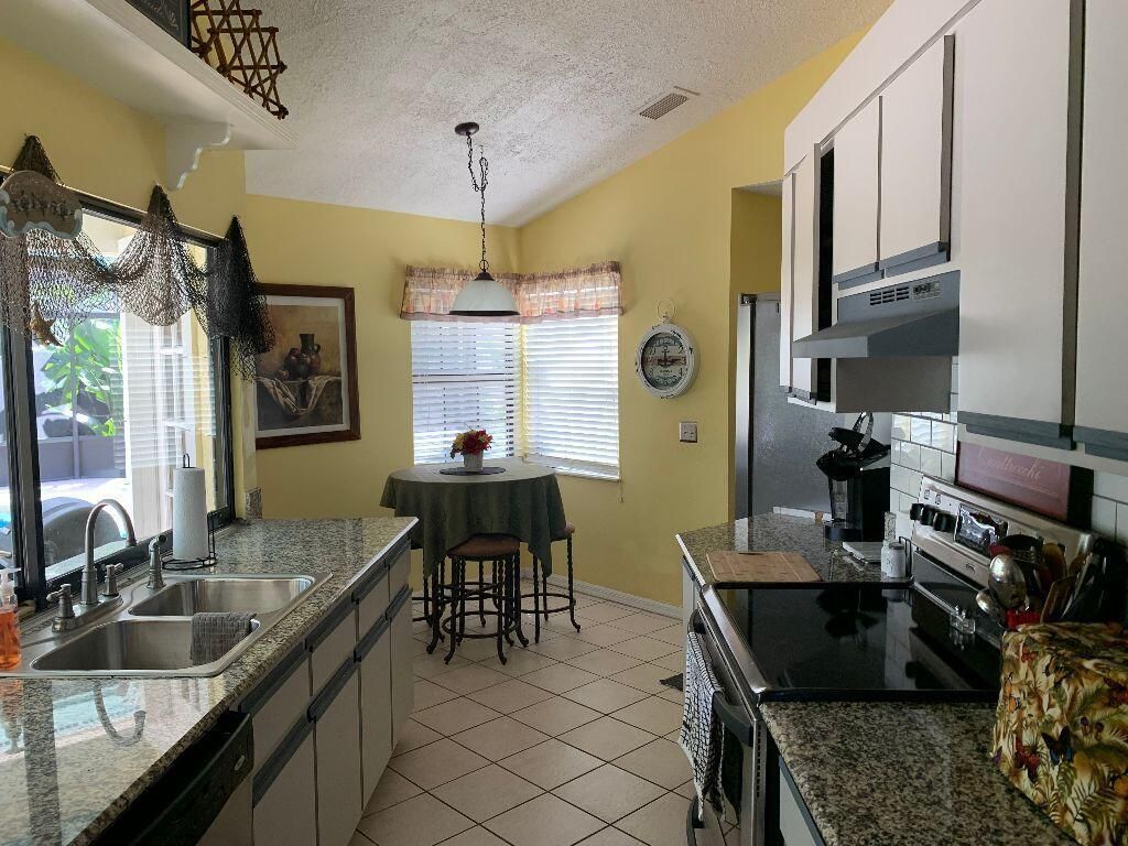 Photo of 586 SE Penn Avenue, Port Saint Lucie, FL 34952 (MLS # R10893679)