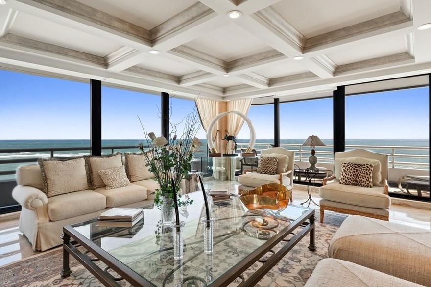 A residence like no other...  N-1201/1202 is a breathtaking 5 bedroom, 6.5 bath, highly sought after, double residence at The Addison On The Ocean, boasting nearly 6,000 square feet of luxury living space. The elevator that leads to this residence arrives at a private lobby.  Upon entering through the double doors, you're welcomed by a gorgeous foyer and immediately struck by lavish extras and meticulous attention to detail... a tray ceiling with custom lighting, marble columns and extraordinary ocean views.  The living room features a coffered ceiling, custom lighting and floor to ceiling impact glass windows showcasing the phenomenal wrap-around corner vistas. The living room features a separate lounge area with a built-in wet bar that includes a sink, refrigerator, dishwasher, burled wood cabinetry and columns, and granite counters. This space is designed for oceanfront entertaining!

The next grand space for entertaining is the formal dining room.  This incredible dining area overlooks the sparkling ocean with custom built-ins, a tray ceiling, double chandeliers and remote controlled window shades. For the ultimate in dining luxury, the doorway that leads to the kitchen can be closed off for a private dining experience and there is a pass-through service window for kitchen-to-dining catering needs. The gourmet chef's kitchen features burled wood cabinetry, including two SubZero refrigerators with coordinating burled wood panels, granite countertops and backsplash, double wall ovens, custom lighting and a built-in desk area.  There is a large eat-in kitchen area that overlooks the ocean as well.

The primary suite encompasses nearly 870 square feet of extravagance overlooking the ocean.  The suite features a generous sitting area with a built-in wet bar, including an ice maker, sink and electric. Custom cabinetry in the suite features a concealed television lift cabinet, media storage, both tray ceiling and coffered ceiling and decorative lighting.  There are two ensuite bathrooms... The bathroom to the left includes marble floors, a corner spa tub, etched glass enclosed steam shower, mosaic marble details, oversized bathroom counter, vanity seating, linen closet and separate water closet. The bathroom to the right features granite floors, pebbled wallpaper treatment, oversized counters and custom tile trim work. The primary suite also includes two walk-in closets with custom shelving, storage island, drawers and cabinetry.

There are four more additional suites in this massive residence. One of the four suites is currently being utilized as an office, yet it still has characteristics of a bedroom, with a closet and a bathroom.  It features hardwood floors, handsome built-in library style shelving with a wet bar that includes refrigeration.  There are sweeping west views of the city of Boca Raton from this suite.  There is private entry from your elevator lobby into the office suite for the ultimate in professional discretion.  Guests may privately enter your office without entering into the rest of the residence. The bathroom that accompanies the office features granite counters, hardwood cabinetry, double vanity with hammered metal stainless sinks, custom tile work and views of the city from the multi-head glass enclosed shower.  The three additional guest suites each have an ensuite bathroom, it's as if there are five primary suites in this residence!  

The first guest suite has spectacular views of the city, soffit lighting, neutral Berber carpet, black-out window shades, a separate sitting area, walk-in closet and a gorgeous ensuite bathroom.  The bathroom features black lacquered cabinetry, marble vanity with double chrome sinks and hardware, custom mirror with black marble trim, glass enclosed shower and custom marble inlay flooring.

The second guest suite has endless city views, neutral berber carpet, wood plantation shutters, a walk-in closet and a beautiful ensuite bathroom.  The bathroom features marble floors, granite counters, contemporary wood cabinetry, quatrefoil shaped chrome sinks with chrome hardware and glass enclosed shower.

The third guest suite features plush carpeting, grass-cloth wallpaper, a tray ceiling and a walk-in closet.  It's located on a corner of the residence with views that stretch from the city to the ocean on two separate balconies!  The ensuite bathroom features gleaming floor to ceiling marble walls and flooring, custom 'farm house' look cabinetry, marble counters, glass enclosed shower with soaking spa tub and a separate water closet that is set back for ultimate privacy.

A second office suite is located off the main hallway and features recessed lighting with a custom built-in L-shaped desk with shelving and cabinetry that maximizes the space.

The powder room is the last of the 6.5 bathrooms and includes a scallop shaped pedestal sink with brushed nickel and crystal faucet hardware, wall sconces and décor wallpaper.

N-1201/1202 is laden with decorative trimmings... custom crown moldings, décor baseboards, polished marble floors, inlays in the flooring, custom lighting, tray and coffered ceilings, hardwood built-ins, in-ceiling speakers, hardwired audio, security system and more.  Yet the most remarkable feature of this residence are the all encompassing ocean to city views.  Whether you're sipping your morning coffee with sunrises over the ocean or relaxing with a beverage enjoying the sun setting over the city... N-1201/1202 is the epitome of oceanfront luxury living.