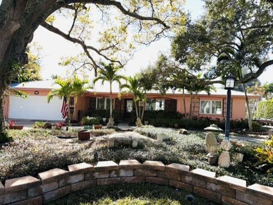 99 ft of waterfront in this serene residence nestled in sought after Vero Isles on quiet cul de sac  Views of open water  Backyard boasts a 50 ft newer dock with 2 boat lifts 30,000 lbs & 10,000 lbs. on deep water wide canall. Amazing Saltwater, heated resort style pool &expansive lanai, spectacular views of the Indian River Lagoon.  Resort feeling. Impact windows, 1 yr old central air, whole home generator, metal roof & nearly new docks.  2300 sq ft of classic CBS construction.   Split BR plan for guest comfort.  Whole home irrigation system upgraded with automated remote.  Kitchen remodeled in 2021. No HOA.  Minutes to beaches and shops and will be within walking distance of the ''3 Corners'' project to include waterfront dining and shops.  Centrally located