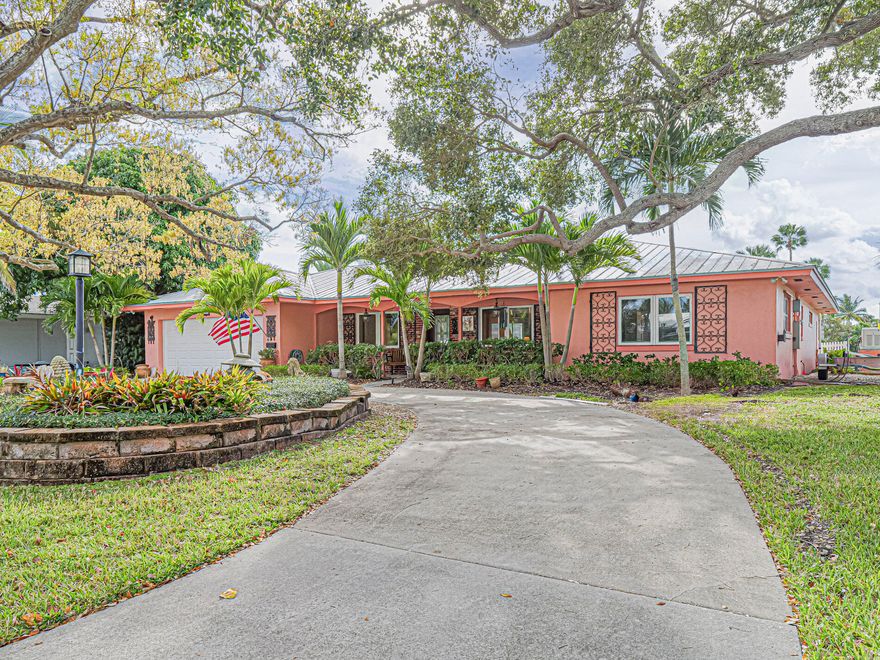 99 ft of waterfront in this serene residence nestled in sought after Vero Isles on quiet cul de sac  Views of open water  Backyard boasts a 50 ft newer dock with 2 boat lifts 30,000 lbs & 10,000 lbs. on deep water wide canall. Amazing Saltwater, heated resort style pool &expansive lanai, spectacular views of the Indian River Lagoon.  Resort feeling. Impact windows, 1 yr old central air, whole home generator, metal roof & nearly new docks.  2300 sq ft of classic CBS construction.   Split BR plan for guest comfort.  Whole home irrigation system upgraded with automated remote.  Kitchen remodeled in 2021. No HOA.  Minutes to beaches and shops and will be within walking distance of the ''3 Corners'' project to include waterfront dining and shops.  Centrally located