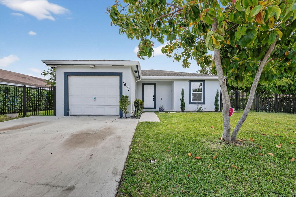 Photo of 1691 W 26th Court, Riviera Beach, FL 33404 (MLS # B26015415)