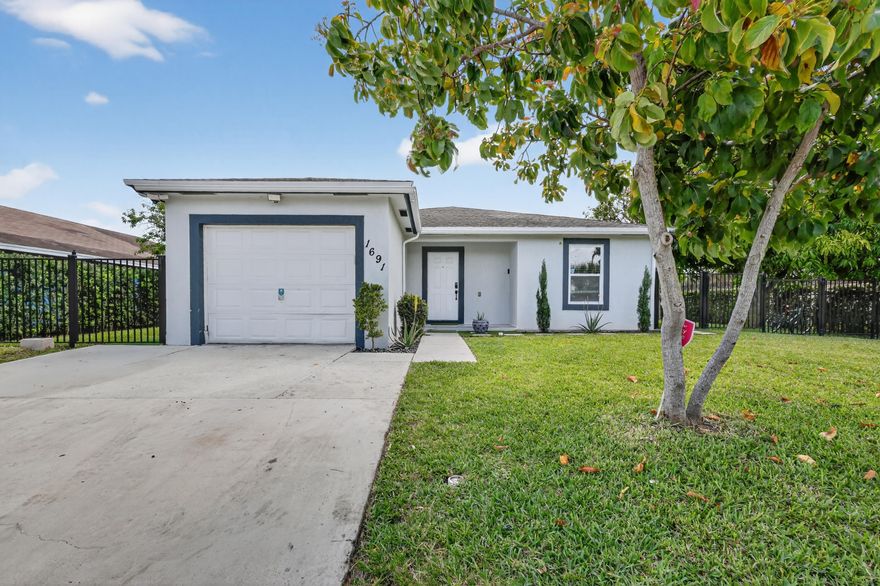 Completely upgraded home, which truly offers Florida living at its best. The property features an open layout kitchen and family space,  complemented by new wood and tile flooring throughout. It also includes a new master bathroom with modern walk-in closets.  The exterior is just as impressive, boasting amazing landscaping with several fruit trees and a beautiful backyard garden .There is also an open porch, which is perfect for enjoying the Florida weather. The home is conveniently located near major highways, shops, and schools, and is only minutes away from the beach. This property is a must-see! Please schedule a viewing as soon as possible.