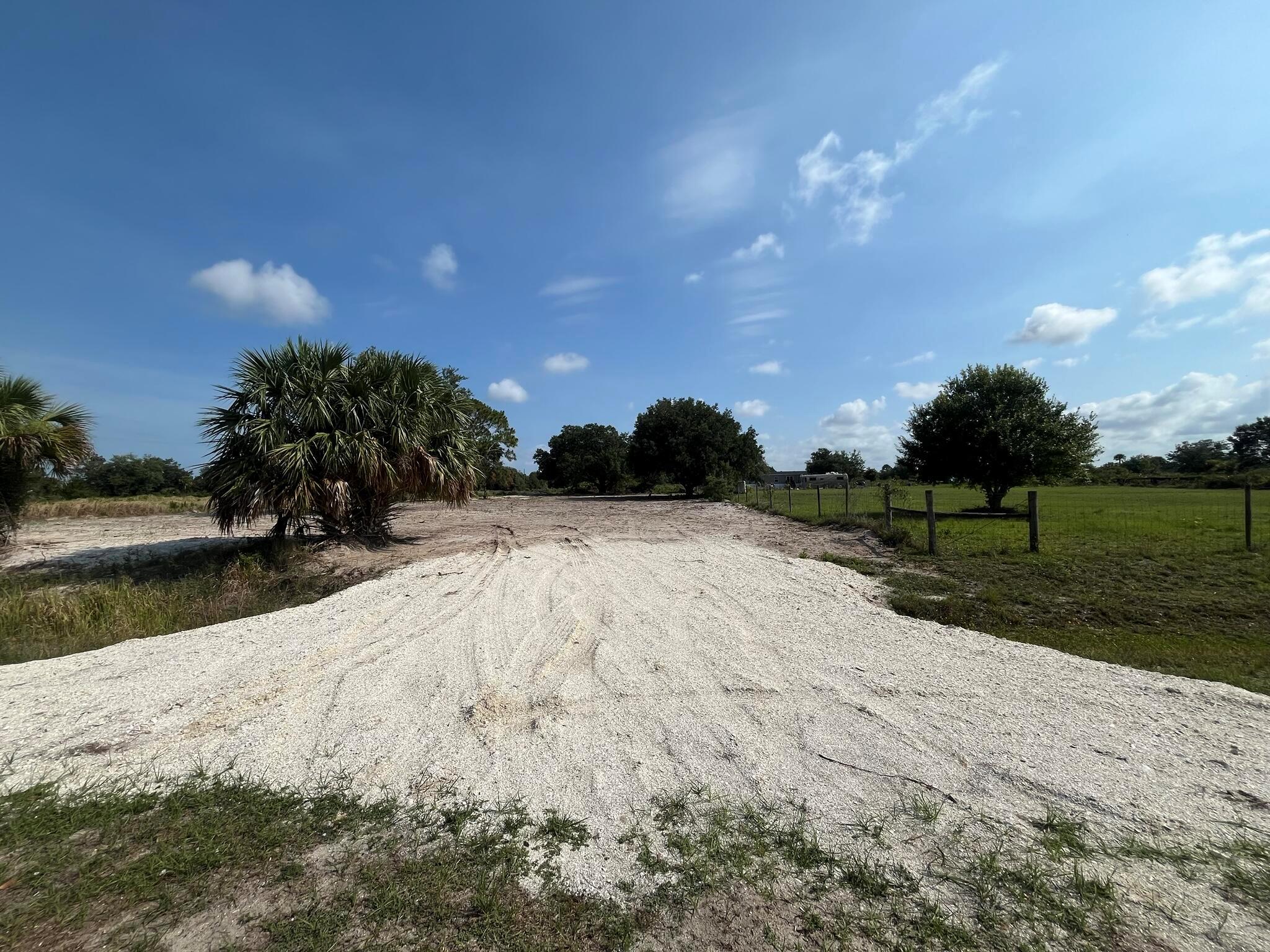 Build or bring your dream home and barn on this beautiful private high and dry corner lot 1.25 acre just off of the main paved road but yet still private. The property is cleared with a culvert in place. This canal lot is at the end of the road for added privacy. The area is not just a haven for those seeking solitude but also a paradise for outdoor enthusiasts. The nearby Kissimmee River Preserve State Park and the flowing Kissimmee River into Lake Okeechobee are hotspots for some of the best fishing experiences. Whether your interests lie in fishing, hunting, agriculture, or simply enjoying a private life away from the hustle, this locale promises a lifestyle filled with the joys of the natural Floridian landscape