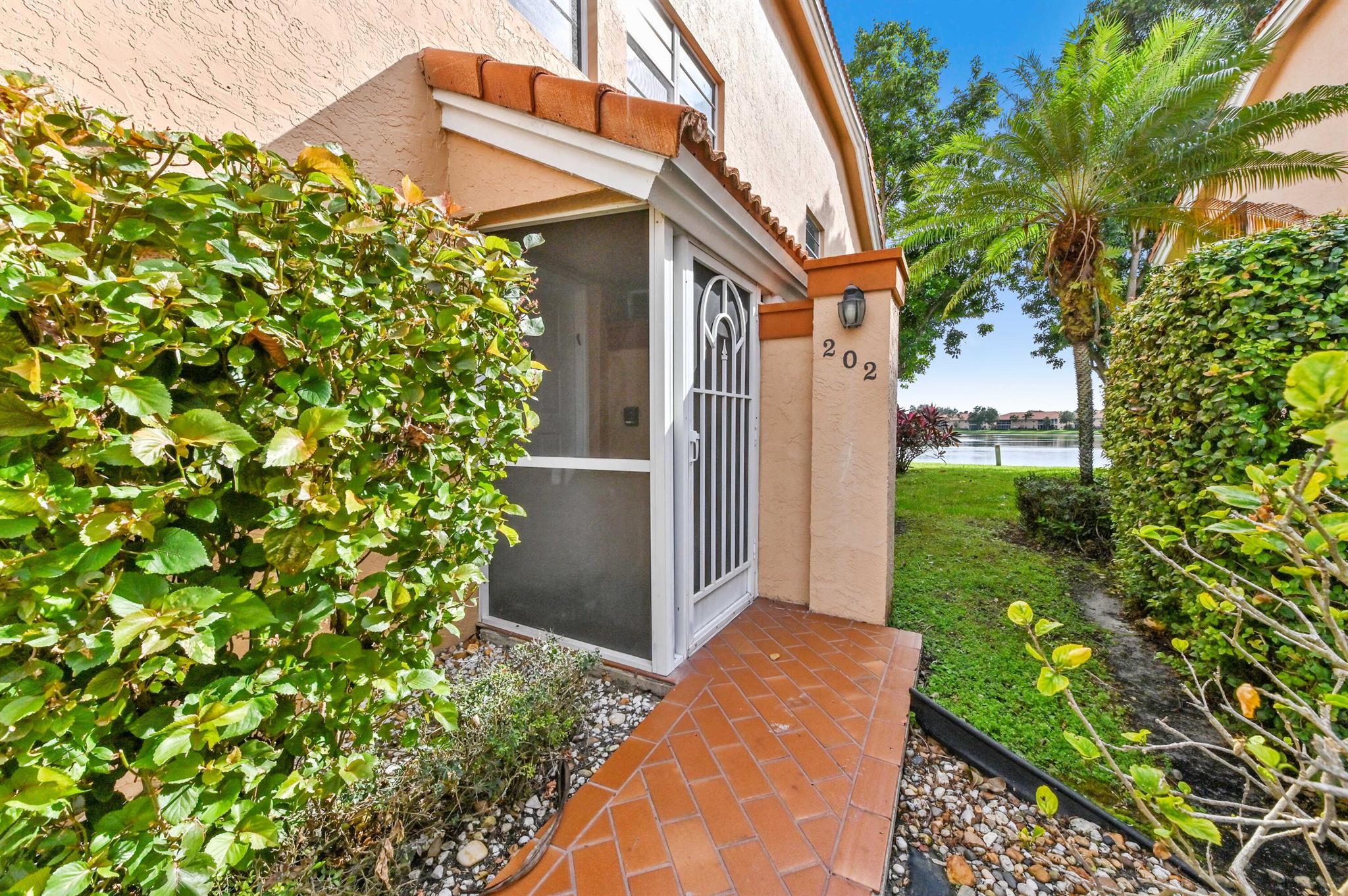 Welcome to serene, easy living at 9553 Shadybrook Drive, a beautifully appointed coach home situated in the active adult community of Palm Isles, Boynton Beach, FL. Experience the allure of a lifestyle marked by a tranquil ambiance combined with the vibrancy of Palm Isles. As you step into the second-floor home, captivating vaulted ceilings greet you. The space is uplifting, with an expressive openness that invites natural light in, fills the surroundings with supreme brightness. Adding to your comfort and convenience, a dedicated laundry section streamlines your daily chores. A splendid revelation inside this home is its chef's dream kitchen. Designed in an elegant open-concept layout, the gourmet kitchen boasts stainless steel appliances that enhance culinary creativity.