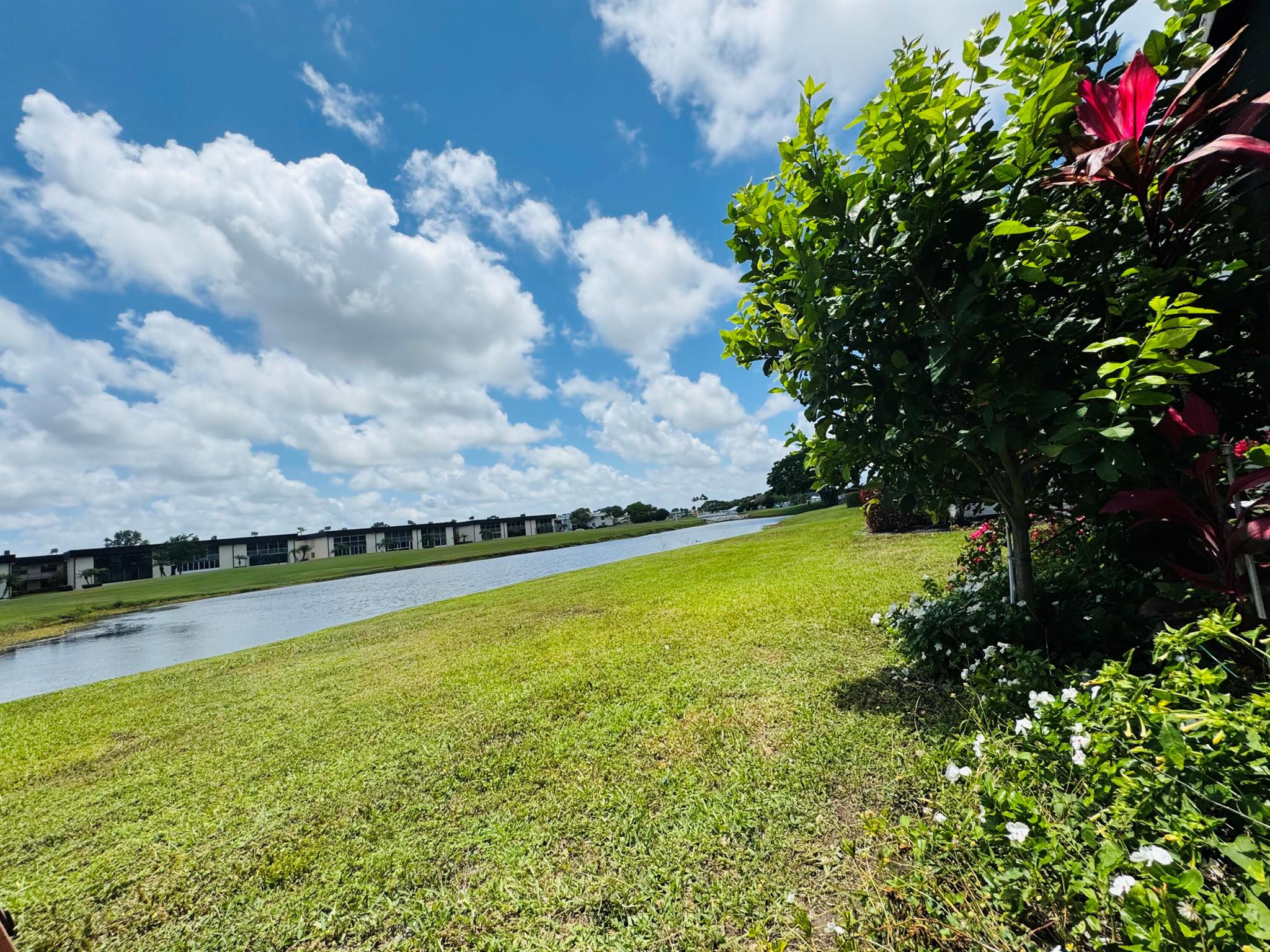 Enjoy life on the water with your lake and golf course views from your enclosed patio!Freshly painted, New AC, water heater, recessed lighting throughout.Bathrooms, floors, kitchen, washer and dryer have been upgraded. Bonus- A beautiful garden has been created for you to enjoy on the side of the apartment. Must see this amazing unit in person.Photos coming soon!