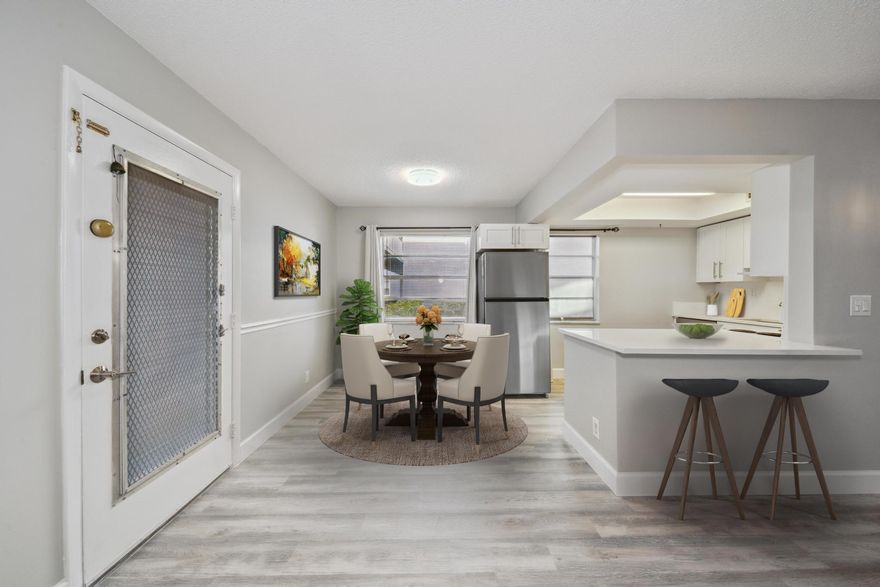 This exceptional 2-bedroom, 2-bath spacious GROUND FLOOR unit offers stylish and accessible living with NO STAIRS. Located in a 55+ community, airport within 20-30- minutes either way, hospitals, shops, and restaurants, this corner unit features modern updates including newer appliances, beautiful kitchen, updated flooring, and renovated bathrooms. The lanai, with its beautiful garden view, has insulated walls, tinted windows, an extra A/C unit, and a separate laundry room. Enjoy a short walk to the pool and clubhouse, offering plenty of recreational options. Kings Point provides access to golf courses, bus services to surrounding areas, shopping centers, and much more. Combining comfort, style, and convenience, this unit is the perfect place to call home for many years to come.