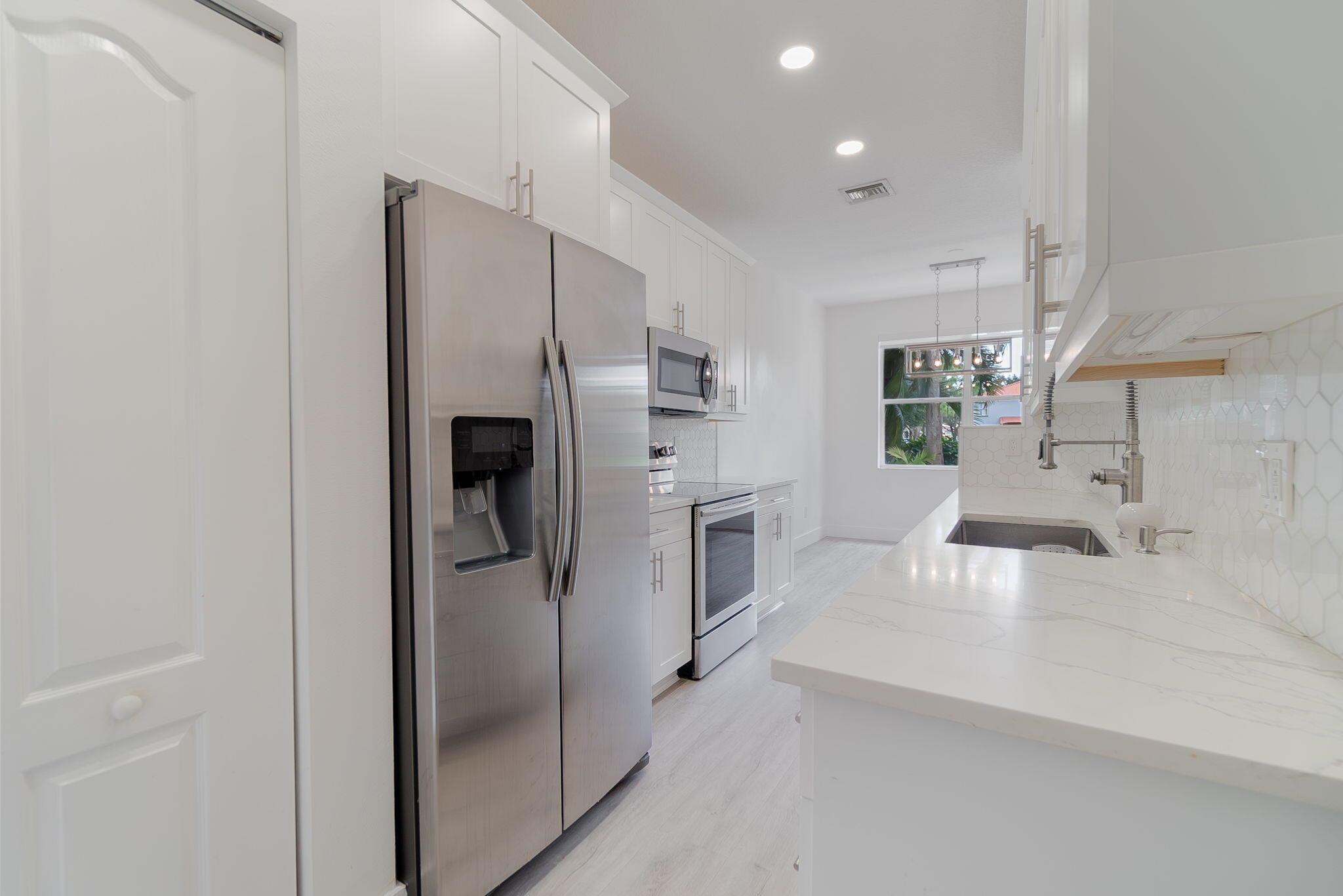 Stunning, fully remodeled 2BR/2.5BA lakefront townhouse available October 17. This home has been carefully maintained and is move-in ready. It features a 1-car garage and driveway parking in a quiet cul-de-sac. The chef's kitchen has tall white cabinets, sleek black hardware, quartz countertops, and a designer tile backsplash. The main level includes open living and dining areas, along with a convenient half bath. Upstairs, you'll find both bedrooms for added privacy and a dedicated laundry room. Enjoy peaceful water views from the backyard and easy access to nearby schools, shopping, dining, and parks. This is a pristine home in a prime location--don't miss it!