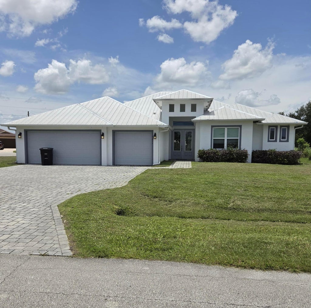 Photo of 5231 NW IREDELL Street, Port Saint Lucie, FL 34986 (MLS # B26077882)