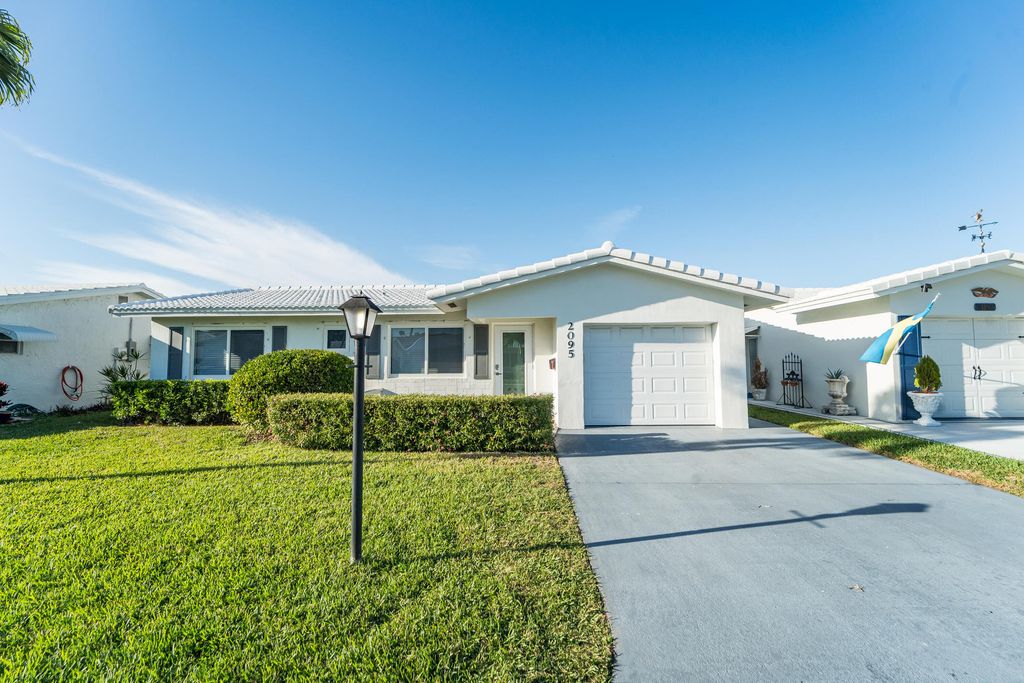 Photo of 2095 SW 14 Avenue SW, Boynton Beach, FL 33426 (MLS # B26001039)