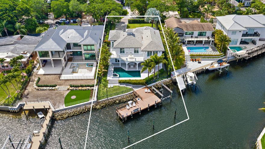 Direct Intracoastal waterfront with wide water views and no fixed bridges, offering rare, hard-to-find dockage with the ability to accommodate multiple vessels, including a sportfish yacht and center console. Located in a no wake zone with direct ocean access, just minutes to the Palm Beach Inlet, this is a true boater's dream. Recently refreshed with a new 2024 roof with copper drip edge, new landscaping and hardscaping, fresh interior and exterior paint, and updated lighting. The home features volume ceilings, five private ensuite bedrooms, a private office / den with water views, and an oversized 3-car garage with lifts ideal for car collectors. Close to world-class golf courses, shopping, dining, and the best of the Palm Beach lifestyle.
