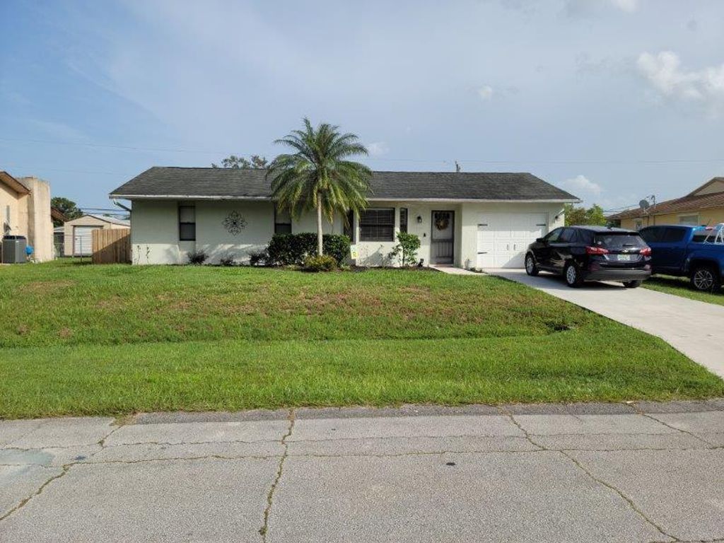 Photo of 822 SW Harvard Road, Port St Lucie, FL 34953 (MLS # R10906550)