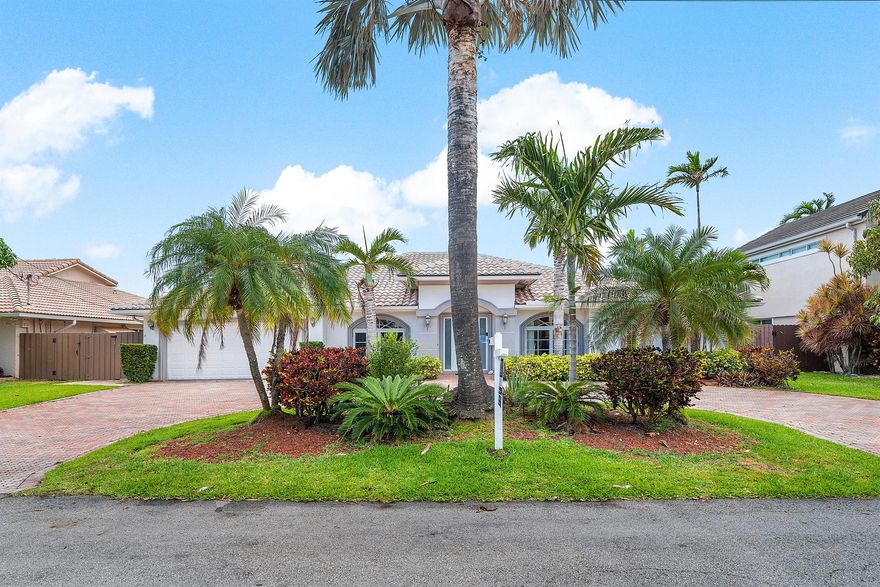 This waterfront gem in Fort Lauderdale offers the perfect blend of comfort, style, and location. The home features impact windows and doors throughout, a split-bedroom floor plan for added privacy, and a spacious master suite designed as a relaxing retreat. The open kitchen with bar seating flows seamlessly into the living areas, creating an ideal space for entertaining. Step outside to a private backyard oasis with a heated pool, tiki hut, and wide water views with no fixed bridges--providing direct ocean access for boating enthusiasts. Additional highlights include a newer AC system and a prime location close to fine dining, shopping, and the beach. This home combines everyday luxury with South Florida's best waterfront lifestyle.