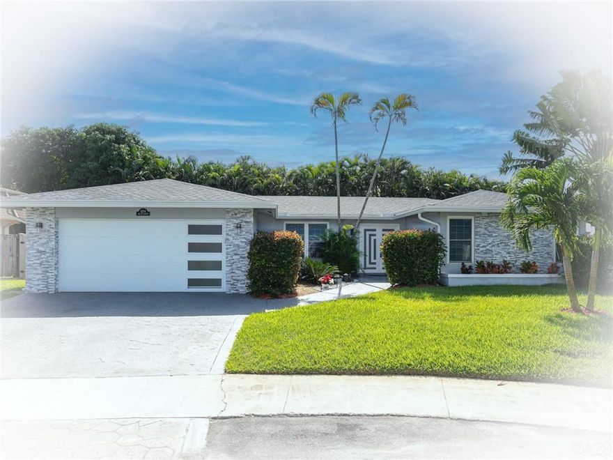 Don’t miss the slideshow. Absolutely “GORGEOUS” pool home on a private cul-de-sac in the heart of Davie. Situated on a large fenced pie-shaped lot, this home has been totally & tastefully remodeled. It features a new roof & AC in 2021, all windows & doors are hurricane rated, including the spectacular front door & garage door. The kitchen features a glass-tiled backsplash, white cabinetry & newer SS appliances. The indoor laundry room has a sink & a new washer n’ dryer, the flooring was replaced, both bathrooms remodeled, fans & light fixtures upgraded, master bath & walk-in closet feature custom barn doors, etc.