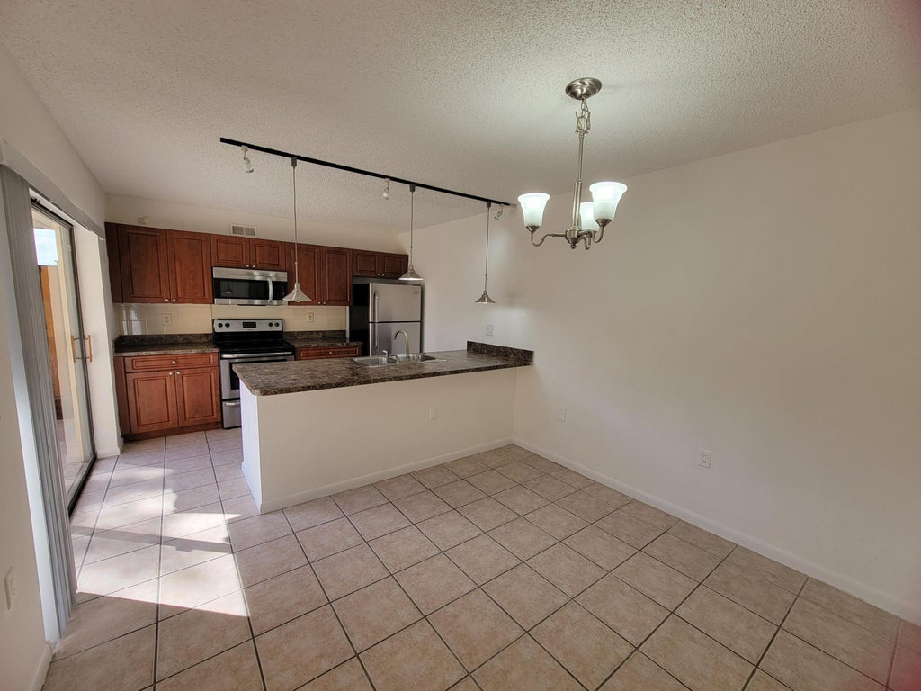 Photo of 588 GREEN SPRINGS Place #588, West Palm Beach, FL 33409 (MLS # B26078352)
