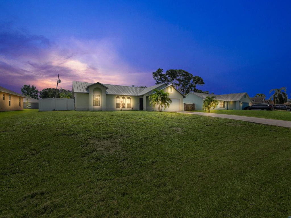 Photo of 3555 SW Masilunas Street, Port St Lucie, FL 34953 (MLS # R10902688)