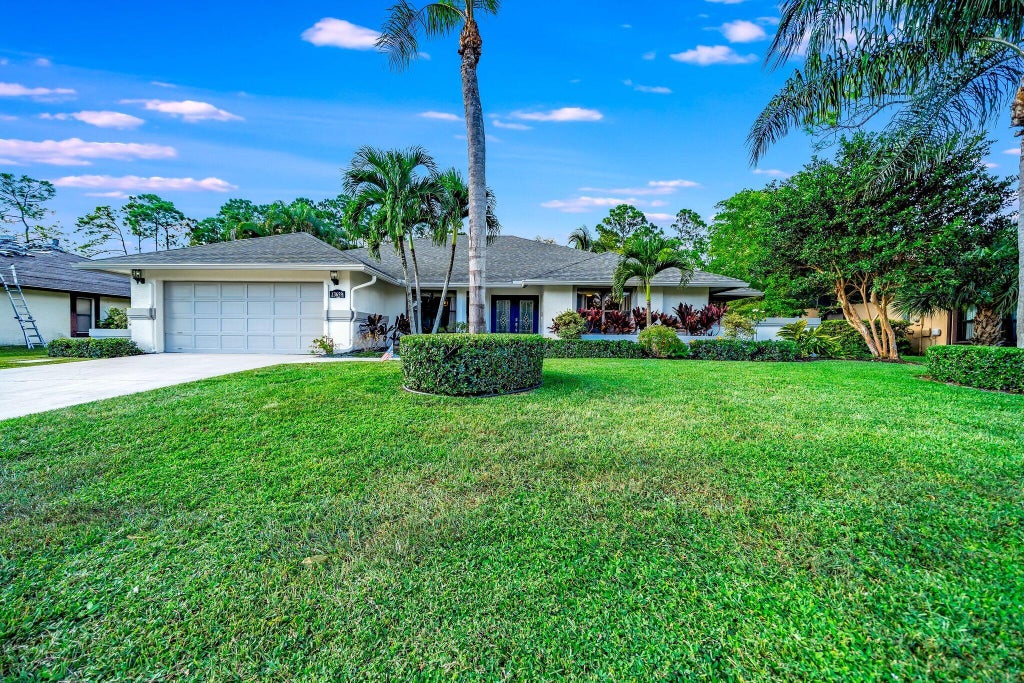 Photo of 13659 Ishnala Circle, Wellington, FL 33414 (MLS # B26050091)