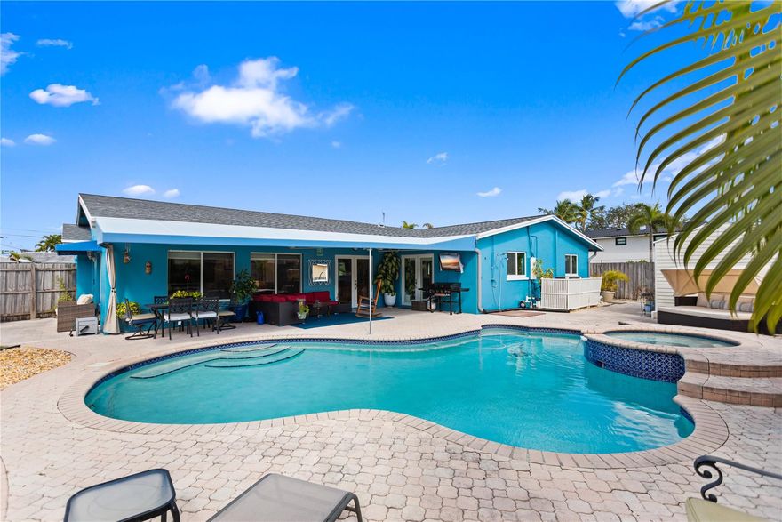 Located in the desirable Jenada Isles, this updated 4-bedroom, 3-bath home sits within a security-gated, camera-monitored neighborhood on a huge double lot. Major upgrades include a new roof (2025), fresh exterior paint (2025), high-impact windows and doors, new plumbing and electrical (2018), A/C and tankless water heater (2019), and a new pool pump/filter (2024). The home features three updated bathrooms, covered patio, a fireplace, WiFi sprinkler system, EV charger, and an 8’ x 10’ storage shed. Thoughtfully improved and move-in ready, this home offers comfort, efficiency, and peace of mind in one of Wilton Manors’ most sought-after neighborhoods.