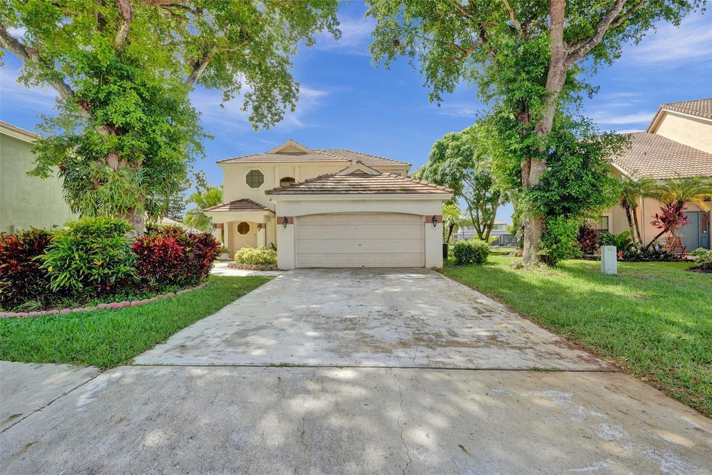 Photo of 6430 NW 58th Terrace, Parkland, FL 33067 (MLS # F10520223)