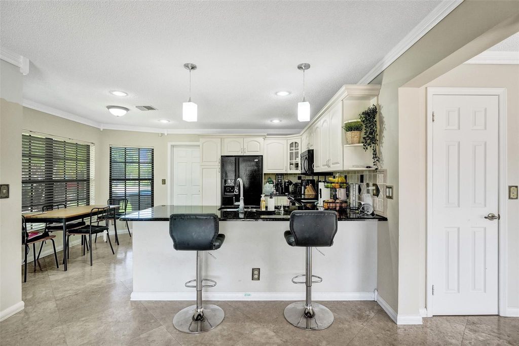 Photo of 6430 NW 58th Terrace, Parkland, FL 33067 (MLS # F10520223)