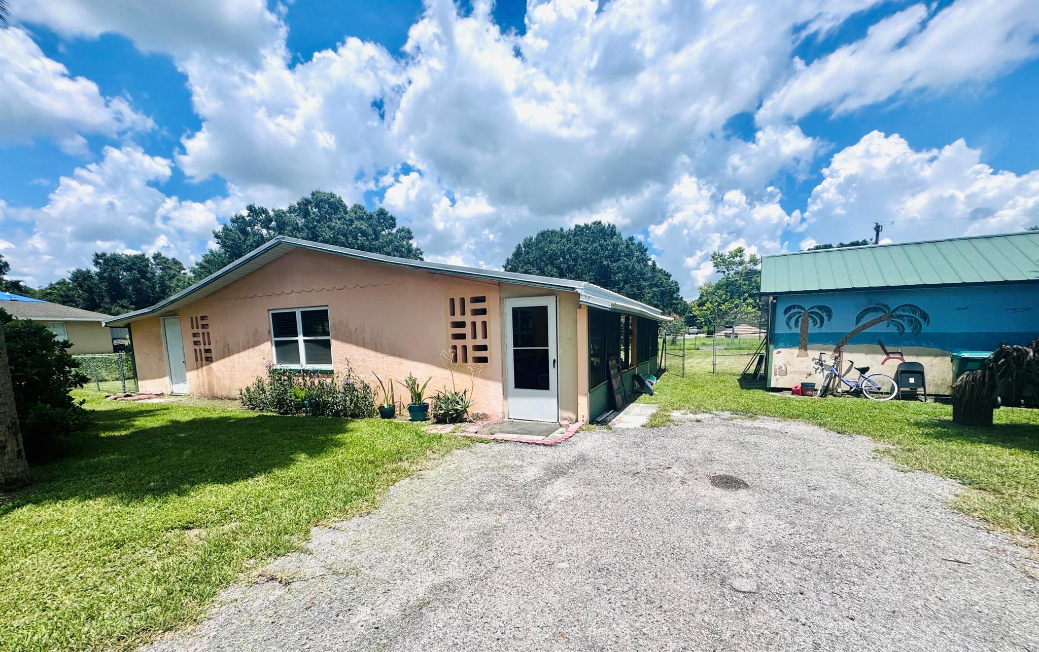 Charming 2 bedroom, 1.5 bath concrete block home with major updates. New roof in 2022, A/C replaced in 2021, and hurricane impact windows installed in 2021 for added safety and efficiency. Features include an updated electrical panel, tankless water heater, and a fenced backyard with a shed that's equipped with electric for extra storage. No HOA and move-in ready. Perfect for first-time buyers, downsizers, or investors. Don't miss this opportunity!