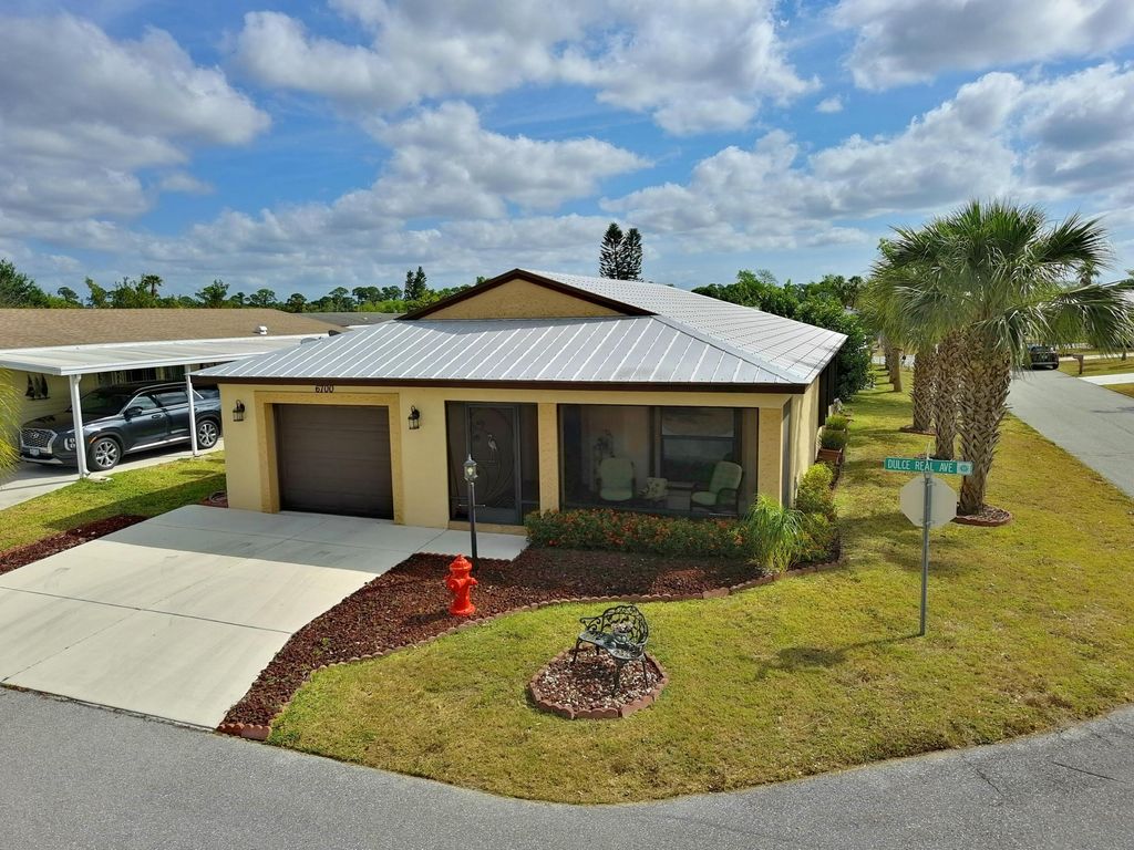 Photo of 6700 Dulce Real Real, Fort Pierce, FL 34951 (MLS # R10980801)