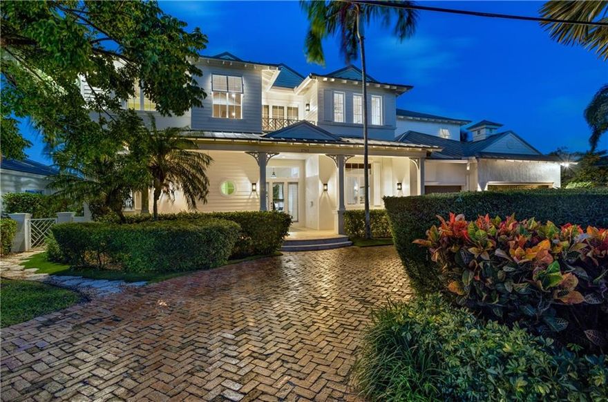 Coastal-Inspired Deepwater Estate sited on 85’ of waterfrontage on the Pelican Waterway Canal. The classic architecture reveals 5 Beds, 6.1 Baths & 6,337+/- total sqft. Volume ceiling foyer leads into a dramatic living room w/impressive double-height tongue & groove wood ceilings. Gourmet kitchen & adjacent family room, breakfast table & powder bath. Two additional bedrooms both w/en-suite baths complete the first level rooms. Upstairs, 2 add'l bedroom suites accompany the primary suite w/dual bathrooms lined in luxurious marble finishes, family room & waterfront balcony. Amenities include 3 bay garage, impact windows, metal roof & more. Entertainment is enjoyed in the pool w/spill-over spa, summer kitchen & large covered loggias. Full service 85’ yacht dock minutes to the Hillsboro Inlet.